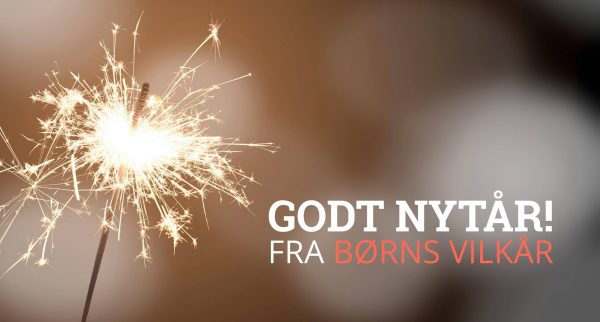 Stjernekaster med teksten 'GODT NYTÅR! FRA BØRNS VILKÅR' ved siden af