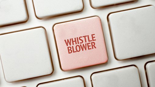 Tastatur med en knap, hvor der står 'WHISTLEBLOWER' på